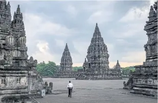  ??  ?? A security guard walks through Prambanan temple complex in Yogyakarta, Indonesia.