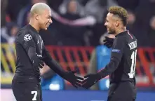  ?? — AFP ?? PSG’S Kylian Mbappe (L) celebrates with team-mate Neymar after scoring a goal against Red Star Belgrade at Rajko-mitic Stadium in Belgarde.