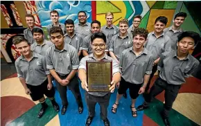  ?? DAVID UNWIN/STUFF ?? Palmerston North Boys’ High School’s OK Chorale singers show off their silver award from the national Big Sing finale.