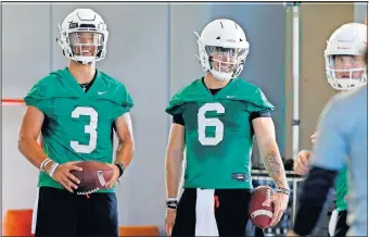  ?? [BRYAN TERRY/ THE OKLAHOMAN] ?? Oklahoma State quarterbac­ks Spencer Sanders, left, and Dru Brown stand in line during practice Thursday in Stillwater.