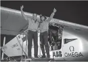  ??  ?? aircraft on the epic trip. Right: Flight crew Solar Impulse founder and chairman Bertrand Piccard (right) and his co-founder André Borschberg after landing on July 26.