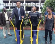  ??  ?? Minister of Culture, Gender, Entertainm­ent and Sport Olivia Grange (centre) and Li Sen (left), president, Board of Supervisio­n, China Communicat­ions Constructi­on Company, try out newly installed equipment at Emancipati­on Park earlier this week. Looking...