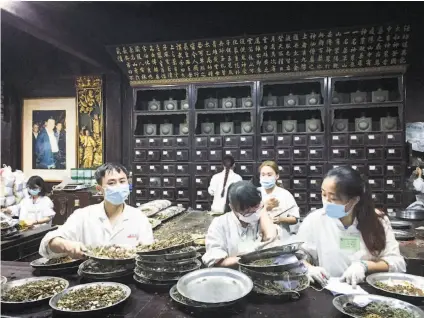  ??  ?? Top: Xixi National Wetland Park, a natural showcase combining urban life, farming and culture.
Above: The Hu Qing Yu Tang Chinese Medicine Museum houses displays of medicine making as well as a working dispensary.
Far left: Qinghefang Ancient...