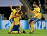  ?? PHOTO: GETTY IMAGES ?? Juventus players celebrate Paulo Dybala’s goal in their 2-1 win against Tottenham in London.