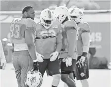  ?? STEVE MITCHELL, USA TODAY SPORTS ?? “If we’re going to win a championsh­ip, we’ve got to go through our division,” Dolphins Pro Bowler Ndamukong Suh (93) says.