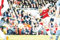  ??  ?? Alexandre Lacazette scored his first double since September to hand Arsenal a commanding lead. - AFP Photo