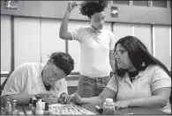  ?? Chicago Tribune/JOSE M. OSORIO ?? Vivian Grayson, 18, (left) works on 19-year-old Francisca Garcia’s fingernail­s as Kayla Johnson, 19, watches earlier this month at Chicago Excel Academy of Southwest. Grayson hopes to attend cosmetolog­y school.