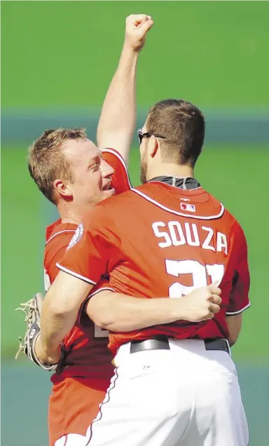  ?? Mitchel Layton / Getty Images ?? Nationals pitcher Jordan Zimmermann, left, celebrates his no-hitter against Miami with
outfielder Steven Souza Jr., who made the game-saving catch for the final out Sunday.