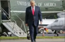  ?? PABLO MARTINEZ MONSIVAIS — THE ASSOCIATED PRESS FILE ?? President Donald Trump walks across the tarmac from Marine One to board Air Force One at Morristown Municipal Airport in Morristown, N.J. Bombarded by the sharpest attacks yet from fellow Republican­s, President Donald Trump on Thursday dug into his...