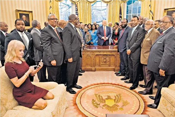  ??  ?? Kellyanne Conway, adviser to the US president, was criticised for her casual shoes-off approach in the Oval Office while taking a picture of Donald Trump with members of the historical­ly black colleges and universiti­es