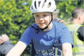  ??  ?? Starting off One pupil is all smiles as she heads off on the challenge