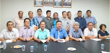  ??  ?? Chai (seated centre) poses with committee members at the press conference.