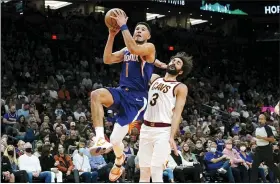  ?? ROSS D. FRANKLIN — THE ASSOCIATED PRESS ?? Suns guard Devin Booker drives past the Cavaliers’ Ricky Rubio during the second half Oct. 30 in Phoenix.