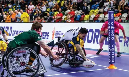  ?? Steven Paston/PA Media ?? Lewis King touches down for a try for England against Australia in the Wheelchair Rugby League World Cup group A match. Photograph: