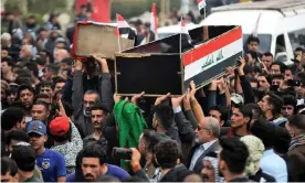  ??  ?? People carry the coffins of anti-government demonstrat­ors killed during protests on Thursday in the central holy shrine city of Najaf, Iraq. Photograph: Haidar Hamdani/AFP/