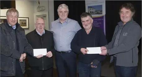  ??  ?? Willie Rooney (second from left) and Mattie Moran (second from right) receive presenatat­ions from Jim Coogan, Dave Murray and Rory Mc Dermott to mark their retirement.