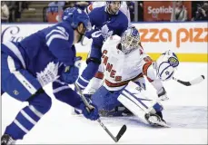  ?? FRANK GUNN / THE CANADIAN PRESS ?? Toronto Maple Leafs left wing Pierre Engvall (47) scores his team’s third goal of the game against Carolina Hurricanes emergency goalie David Ayres in Toronto on Saturday.