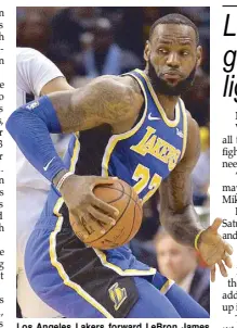  ?? AP ?? Los Angeles Lakers forward LeBron James controls the ball against the Memphis Grizzlies in the first half of an NBA game in Memphis, Tennessee.