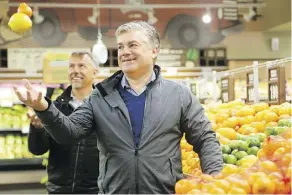  ?? JULIE OLIVER FILES ?? Farm Boy CEOs Jeff York and Jean-Louis Bellemare, back, will stay on in their roles and buy a 12 per cent stake in the new firm after Sobeys Inc.’s parent company bought the Ottawa-area grocer.