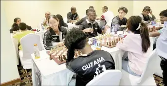  ?? ?? A scene from the Caribbean Blitz Chess Championsh­ip, which was staged on Wednesday at the Ramada Princess Hotel, East Bank Demerara