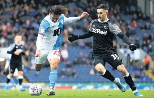  ?? Lewis Storey ?? Bradley Dack of Blackburn Rovers takes a shot whilst under pressure from Tom Lawrence of Derby County