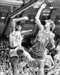  ?? AP 1974 ?? Notre Dame’s Adrian Dantley (left) and his teammates got the best of Bill Walton and UCLA in January 1974, ending the Bruins’ 88-game winning streak.