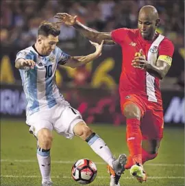  ?? Jonathan Daniel Getty Images ?? LIONEL MESSI, left, moves against Felipe Baloy of Panama on his way to scoring his third goal in Argentina’s 5-0 victory over Panama. He also had an assist.