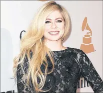  ?? CP PHOTO ?? Avirl Lavigne, seen arriving at the 2016 Clive Davis Pre-grammy Gala in Beverly Hills, Calif., is the most likely celebrity to land users on websites that carry viruses or malware, according to Cybersecur­ity firm Mcafee.