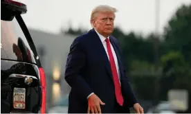  ?? Photograph: Alex Brandon/AP ?? Donald Trump leaves Georgia after being booked into jail on Thursday. Released on $200,000 bail, Trump wasted no time in seeking advantage.