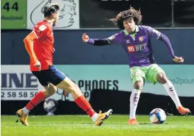  ??  ?? Bristol City’s Han-Noah Massengo is challenged by Luton’s Harry Cornick