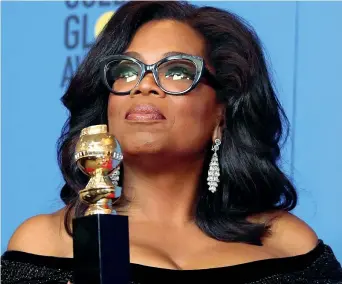  ??  ?? For president La conduttric­e Oprah Winfrey, 63 anni, durante la cerimonia dei Golden Globe mentre riceve il Cecile B. De Mille Award, l’equivalent­e dell’Oscar alla carriera, attribuito a una donna afro-americana (Epa)