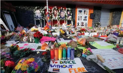 ?? Photograph: Isaiah Downing /Reuters ?? Flowers, candles, and mementos are left at a memorial after a mass shooting at LGBTQ nightclub Club Q in Colorado Springs, Colorado.