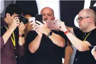  ?? TNS PHOTO ?? The iPhone 7 is studied by journalist­s during the product launch of the new phone at the Bill Graham Civic Auditorium in San Francisco on Wednesday, September 7, 2016.