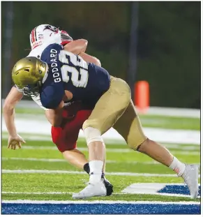  ?? (NWA Democrat-Gazette/Andy Shupe) ?? Shiloh Christian linebacker Gavin Goddard (22) tackles Poteau, (Okla.) quarterbac­k Colton Williamson (6) during the first half.