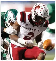  ?? (Arkansas Democrat-Gazette/Thomas Metthe) ?? Fordyce running back Ja’Quez Cross (2) fumbles while being hit by Des Arc cornerback Devonte Holmes in the fourth quarter Saturday. Cross recovered his fumble and continued for a touchdown.