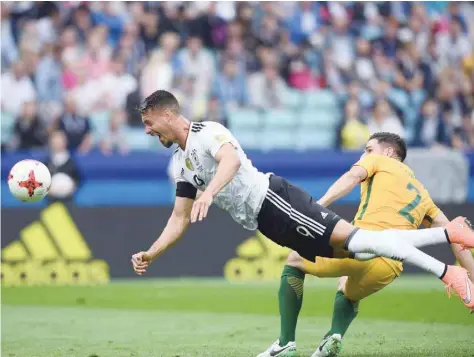  ?? — AFP ?? Germany’s forward Sandro Wagner (L) heads the ball past Australia’s defender Milos Degenek during the 2017 Confederat­ions Cup Group B match in Sochi.