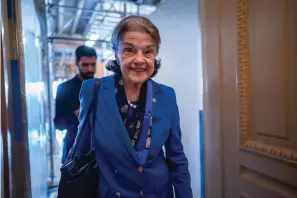  ?? The Associated Press ?? ■ Sen. Dianne Feinstein, D-Calif., walks through a Senate corridor after telling her Democratic colleagues that she will not seek reelection in 2024 on Tuesday at the Capitol in Washington.