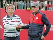  ?? CHRIS CARLSON/AP PHOTO ?? United States captain Davis Love III, right, shakes hands with actor Bill Murray during the celebrity match on Tuesday at Hazeltine National Golf Club in Chaska, Minn.