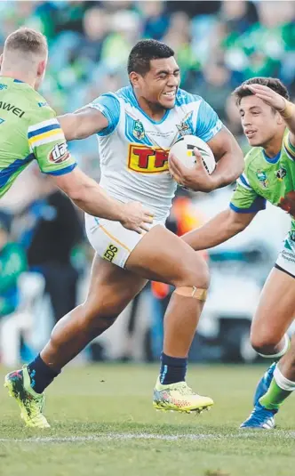  ?? Picture: GOLD COAST TITANS ?? Titans debutant Moeaki Fotuaika takes on the Canberra forwards.