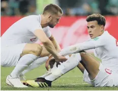  ??  ?? Eric Dier consoles devastated midfielder Dele Alli.