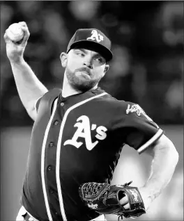  ?? TONY GUTIERREZ/AP ?? Oakland Athletics reliever Liam Hendriks pitches against the Texas Rangers on Sept. 14, 2019, in Arlington, Texas. The Chicago White Sox reportedly signed Hendriks late Monday.