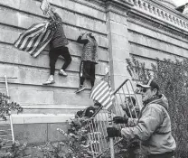  ?? Michael Robinson Chavez / Washington Post ?? Supporters of Donald Trump breach the Capitol on Jan. 6, 2021, in an effort to halt certificat­ion of Joe Biden’s victory.