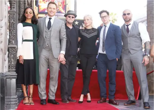  ??  ?? Zoe Saldana (from left), Chris Pratt, Michael Rooker, Pom Klementief­f, James Gunn and Dave Bautista at a 2017 ceremony granting Pratt a star on the Hollywood Walk Of Fame.