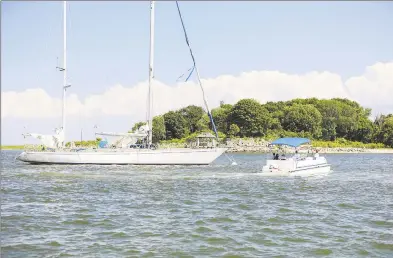  ?? Patrick Sikes / For Hearst Connecticu­t Media ?? The Swany, a 72-foot sailboat, is at the center of a dispute between its owner, James Harding, and the city of Norwalk. City officials say they may to take ownership of the boat, which has been moored off Sheffield Island for months, unless Harding finds a legal place to dock it.