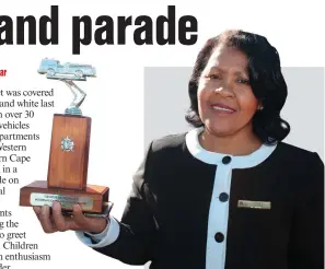  ??  ?? Acting Mayor Charlotte Clarke received a trophy on behalf of George Municipali­ty on National Firefighte­rs’ Day, Friday 4 May.