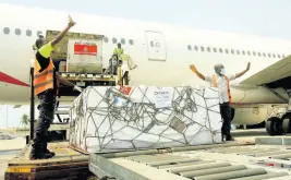  ?? AP ?? A shipment of COVID-19 vaccines distribute­d by the COVAX Facility arrives in Abidjan, Ivory Coast yesterday.