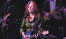  ??  ?? Bonnie Raitt sings “Turn Me Around,” a tune from the civil rights era that she has performed live with Staples.