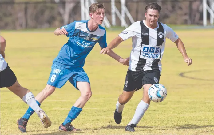  ?? Picture: Kevin Farmer ?? UNDER PRESSURE: South West Queensland Thunder midfielder Jordan Howard (left) pressures Willowburn’s Mitch Tanksy during a trial match.