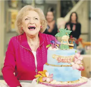  ?? MARK DAVIS/GETTY IMAGES ?? Betty White, seen here celebratin­g her 93rd birthday on the set of Hot in Cleveland, is happy to keep busy working.