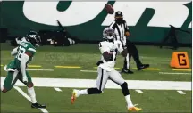  ?? ADAM HUNGER — THE ASSOCIATED PRESS ?? Raiders wide receiver Henry Ruggs III cruises past Jets cornerback Lamar Jackson to catch the winning touchdown in the waning seconds Sunday.